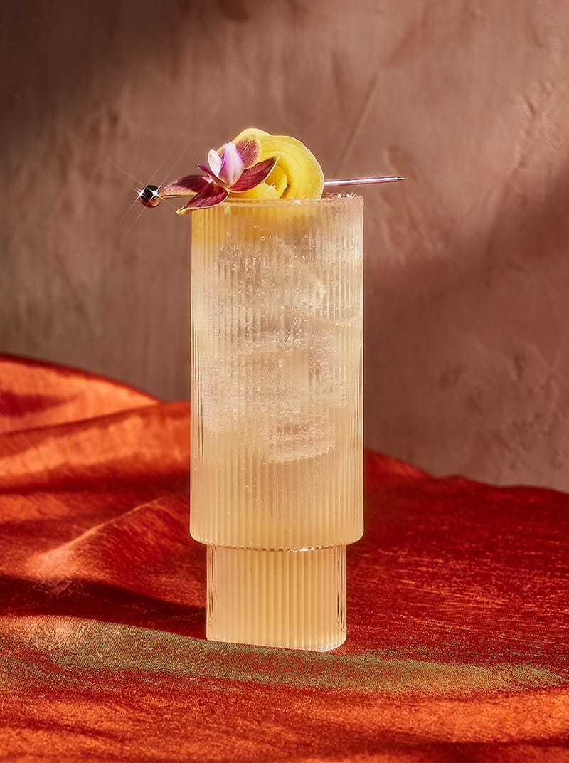 Hard Limonada in a tall glass with flowers
